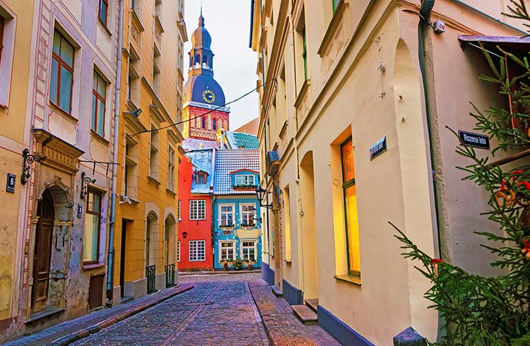 Narrow street leading to St. Peter church in Old Riga
