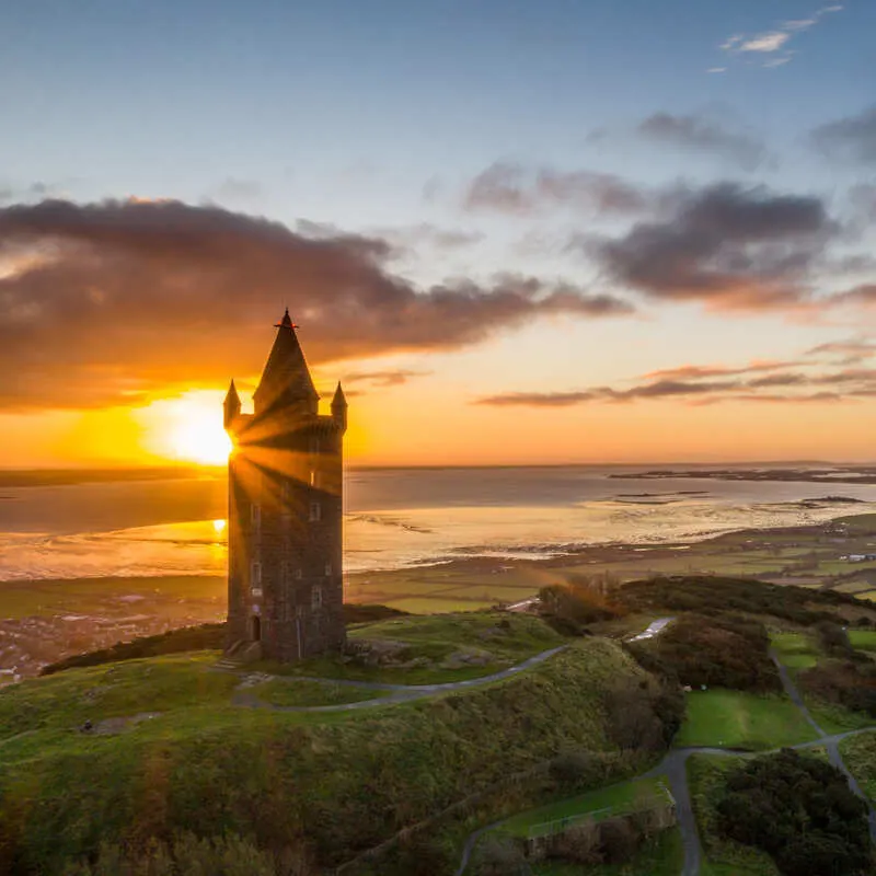 Scrabo Tower Pictured As The Sun Rises Behind It, Northern Ireland, United Kingdom