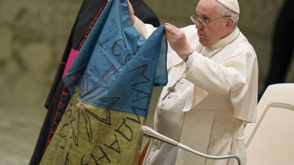 Pope Francis kisses Ukrainian flag from 'martyred' Bucha