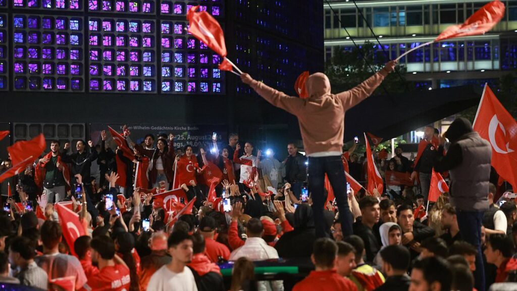 Turkish delight! Jubilant Turks set off fireworks and party in the streets early into the morning across Europe as they celebrate their nation's 2-1 victory over Austria to set up a clash with the Netherlands in the quarter-finals of Euro 2024