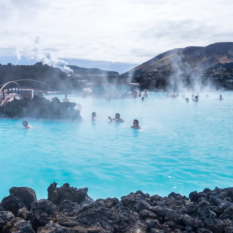 People swimming in the Blue Lagoon geothermal spa in Iceland