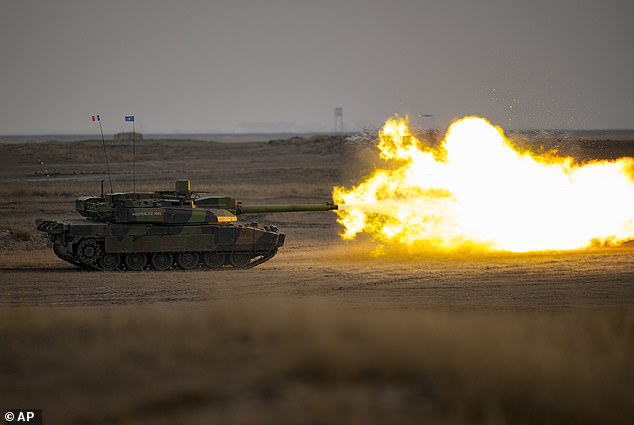A French Leclerc battle tank fires during exercises in Romania on January 25, 2023