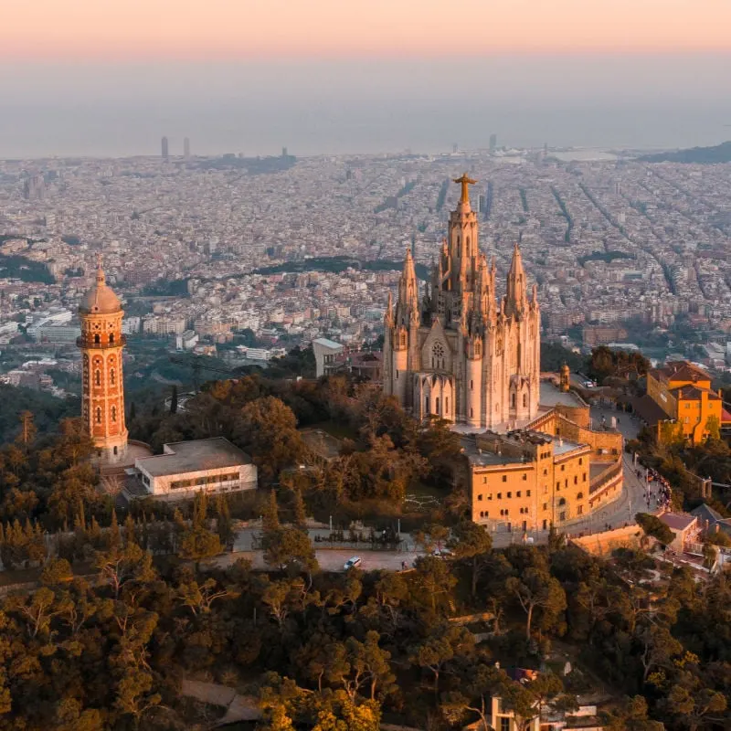 Aerial view of Barcelona skyline with Sagrat Cor temple during sunset, Catalonia, Spain