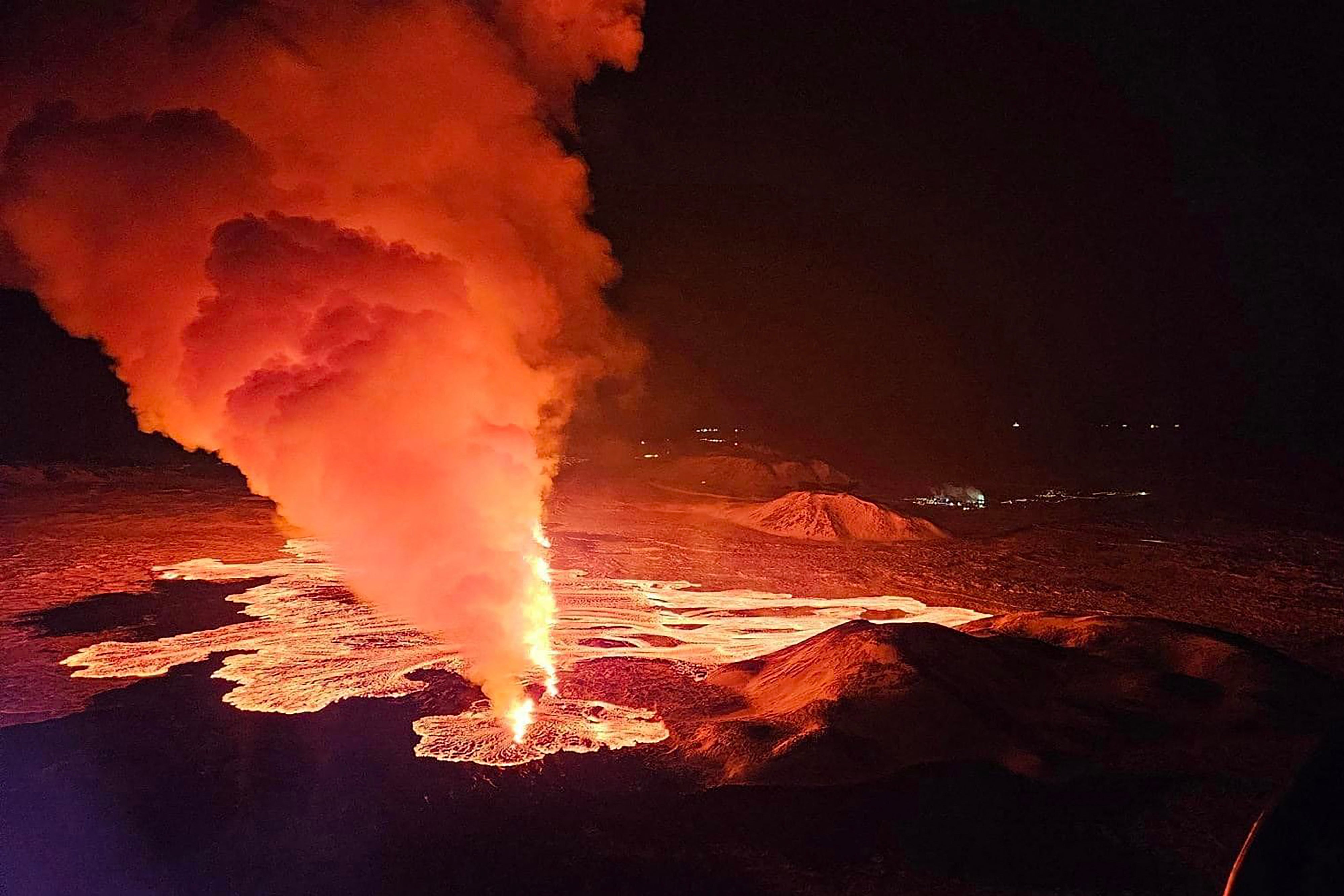 Billowing smoke and flowing lava are seen pouring out of a new fissure in this Icelandic Department of Civil Protection and Emergency Management , 8 February 2024
