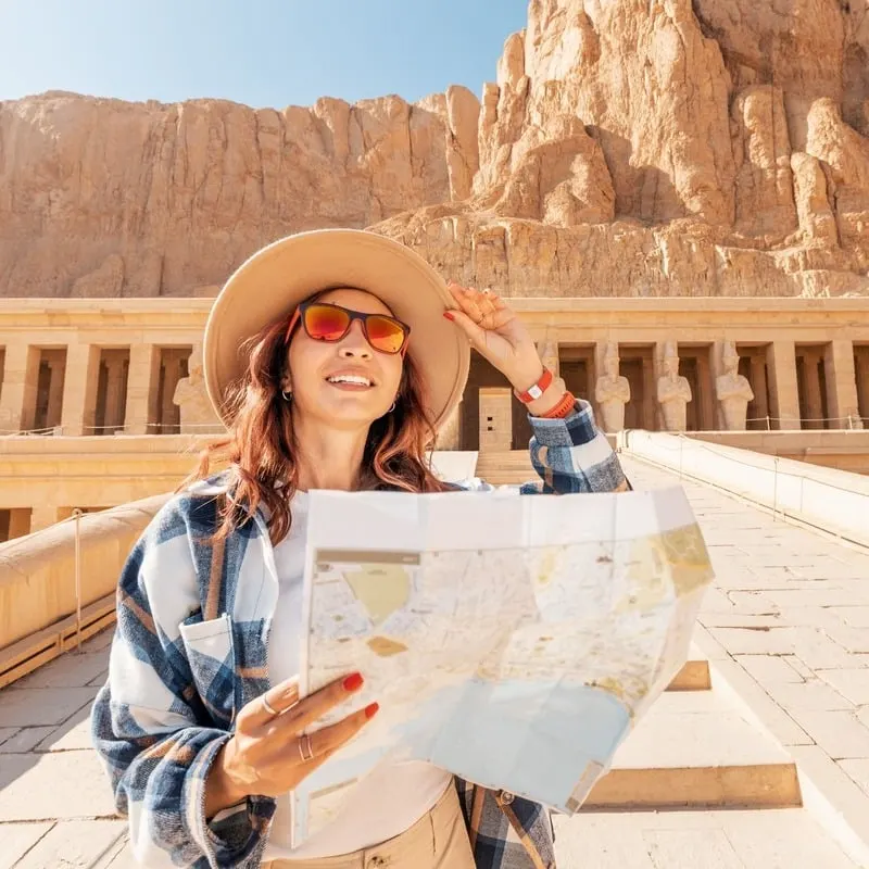 Young Woman Smiling As She Takes A Picture In The Valley Of The Kings In Luxor, Egypt, North Africa