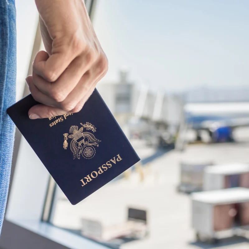 Traveler Holding USA Passport At Airport