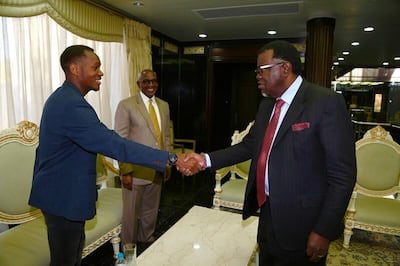 Ryan Nyambe, left, with Namibia's President Hage Geingob