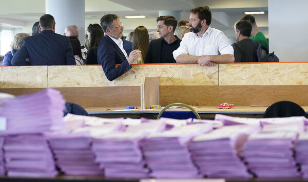 L-R Candidates John Moran and Brian Leddin chatting as counting continues at Limerick Racecourse in Limerick's mayoral election in which citizens voted to directly elect their own mayor for the first time in the history of the State. Picture: Niall Carson/PA Wire