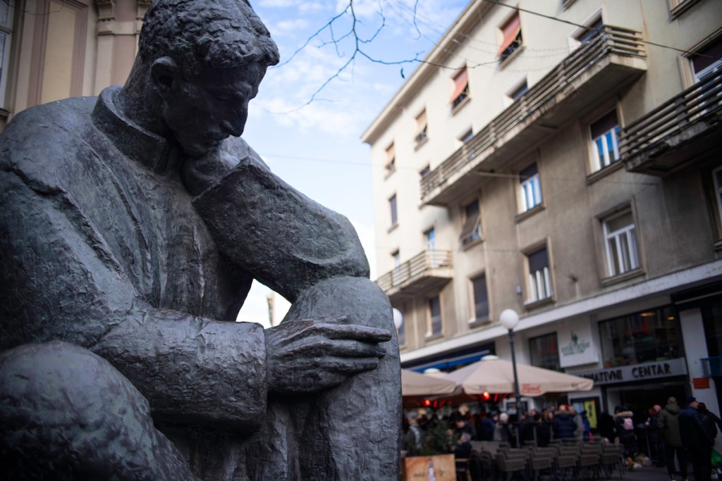 The statue of famous inventor Nikola Tesla sitting thinkfully at Zagreb street