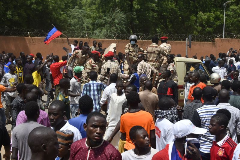Protesters cheer Nigerien troops as they gather in front of the French Embassy in Niamey during a demonstration.