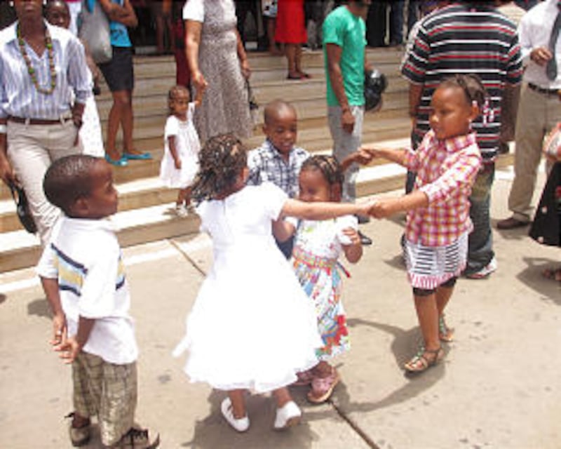 Children play outside the National Assembly Building where the Praia Cape Verde Stake was created on