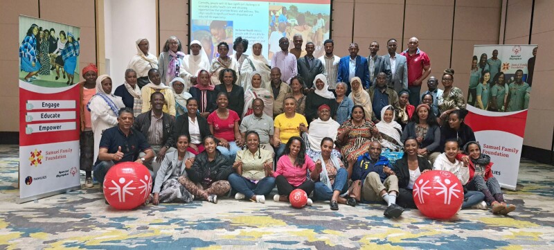 Special Olympics Ethiopia's Families & Siblings workshop: a large group of people sitting together for a group photo