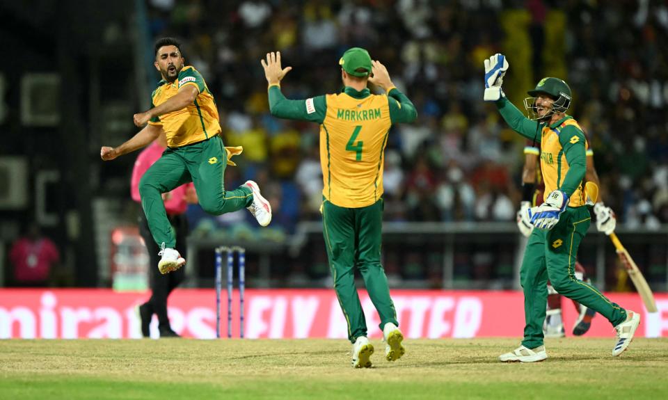 South Africa's Tabraiz Shamsi celebrates with teammates after the dismissal of West Indies' Sherfane Rutherford during the ICC men's Twenty20 World Cup 2024 Super 8 match at Sir Vivian Richards Stadium in North Sound, Antigua and Barbuda on June 23, 2024.