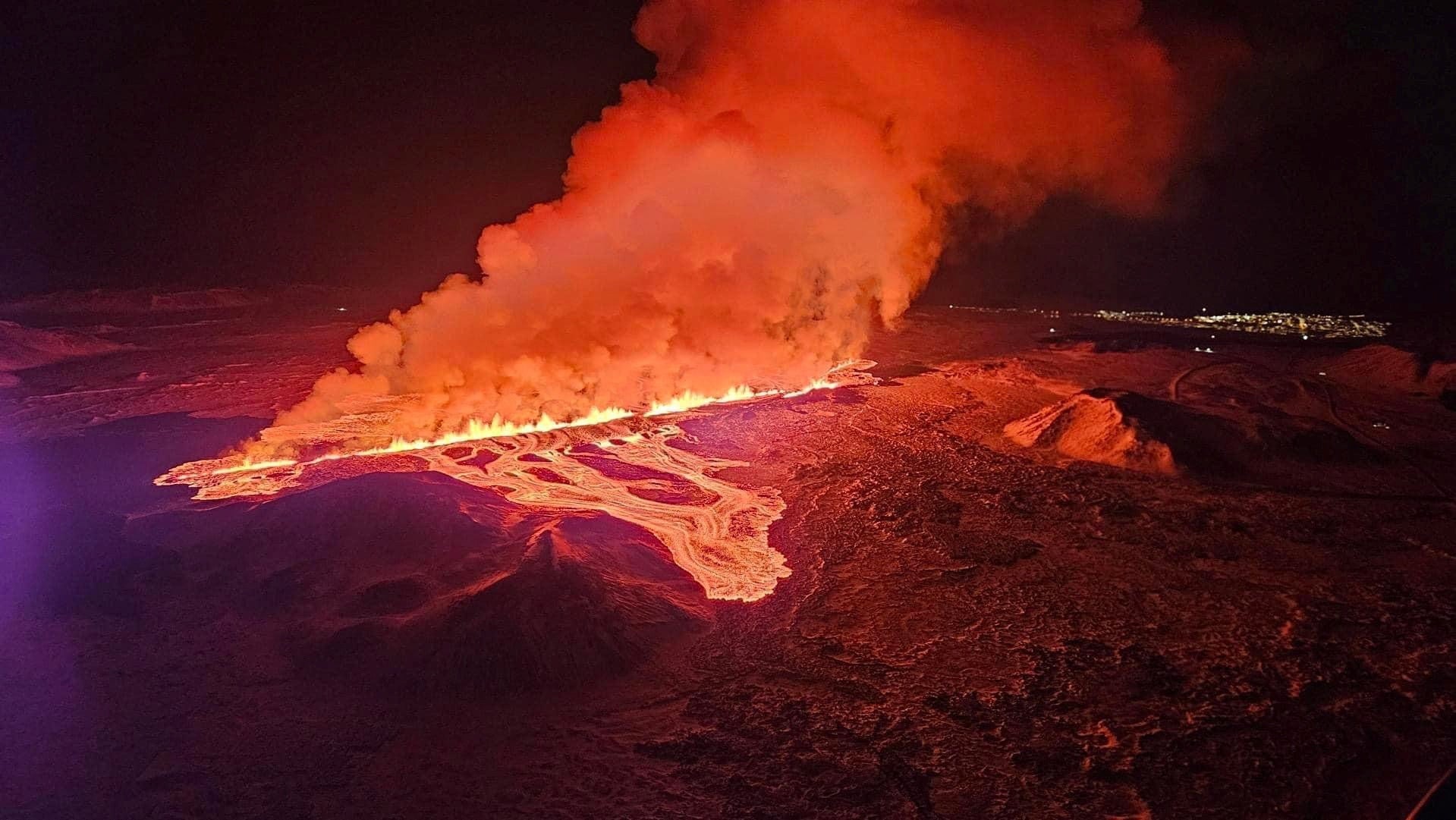 A volcano spews lava and smoke as it erupts, near Grindavik, on Reykjanes Peninsula