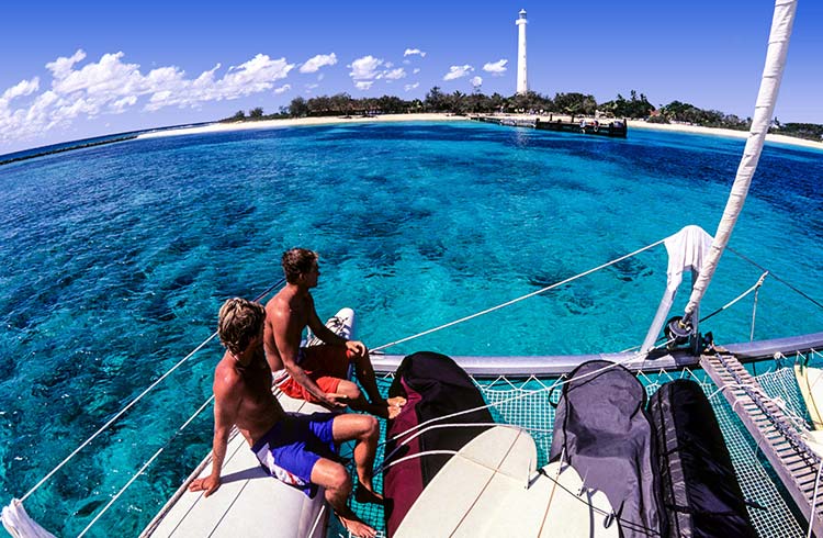 Two travelers on a boat just off Amédée Island, New Caledonia