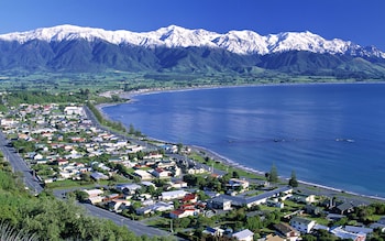 The town of Kaikoura is framed by snow-capped mountains