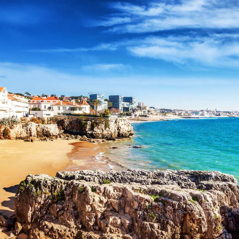 A Golden Sand Beach In Cascais, On The Atlantic Coast, In The Wider Lisbon Metropolitan Area, Portugal, Southern Europe