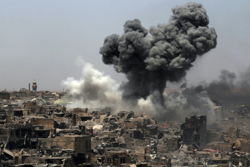 Smoke billows following an airstrike by the US-led international coalition forces targeting Islamic State (IS) group in Mosul, Iraq, on July 9, 2017.