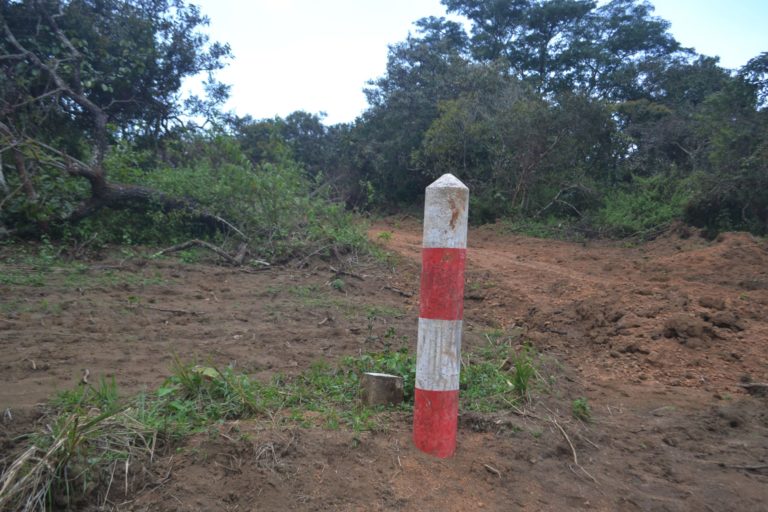 A boundary marker bordering the project area, located in Miguesse village / Image © Yannick Kenné.