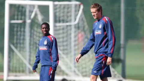 Getty Images Footballers Peter Crouch and Shaun Wright-Phillips training for England.