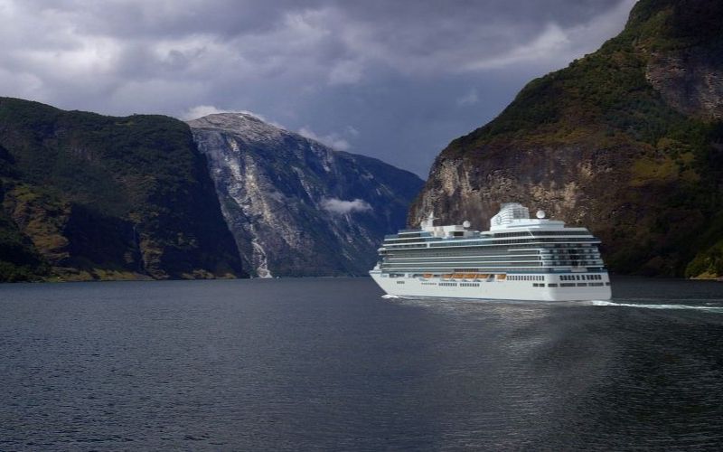 A large white cruise ship named 