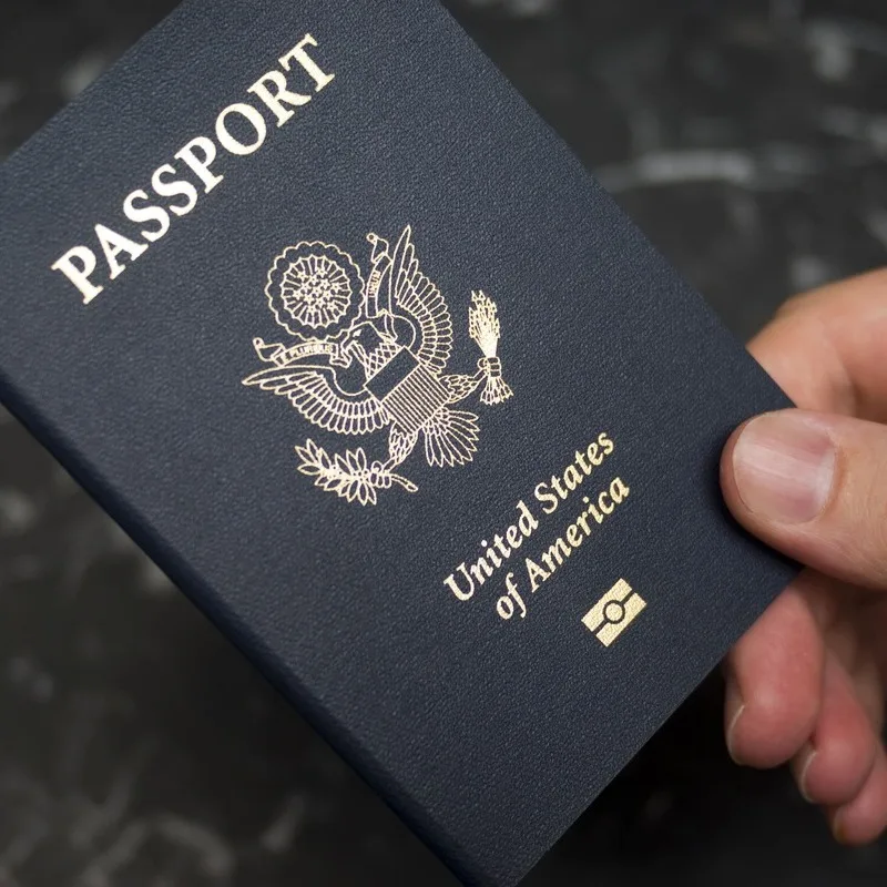 American Traveler Holding A US Passport