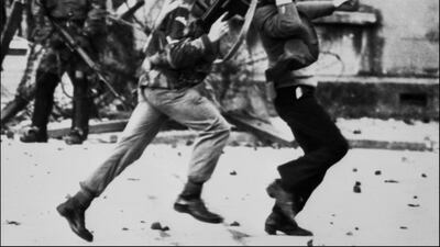 (FILES) In this file photo taken on January 30, 1972 a British soldier drags a Catholic protester during the 