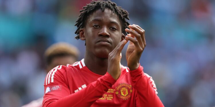 Kobbie Mainoo of Manchester United applauds the fans ahead of the Man Utd vs Fulham live stream