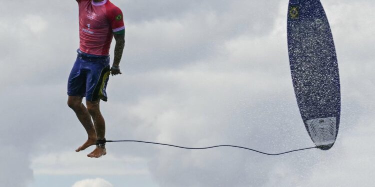 Why Olympic surfing events are in Tahiti, thousands of miles from Paris – NPR