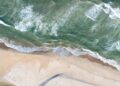 Breathtaking Aerial Perspectives of Eastern Ta’ū Island: Discover Your Coastal Paradise!